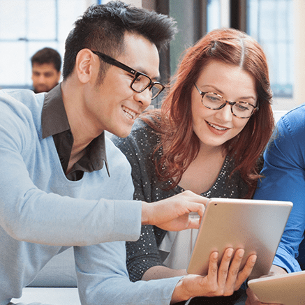 two people looking at tablet