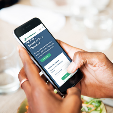 Be Scam Aware Cell phone with First PREMIER app on it